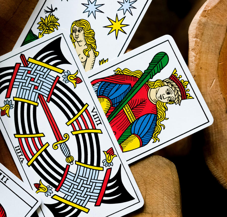 Tarot cards on a wooden surface.